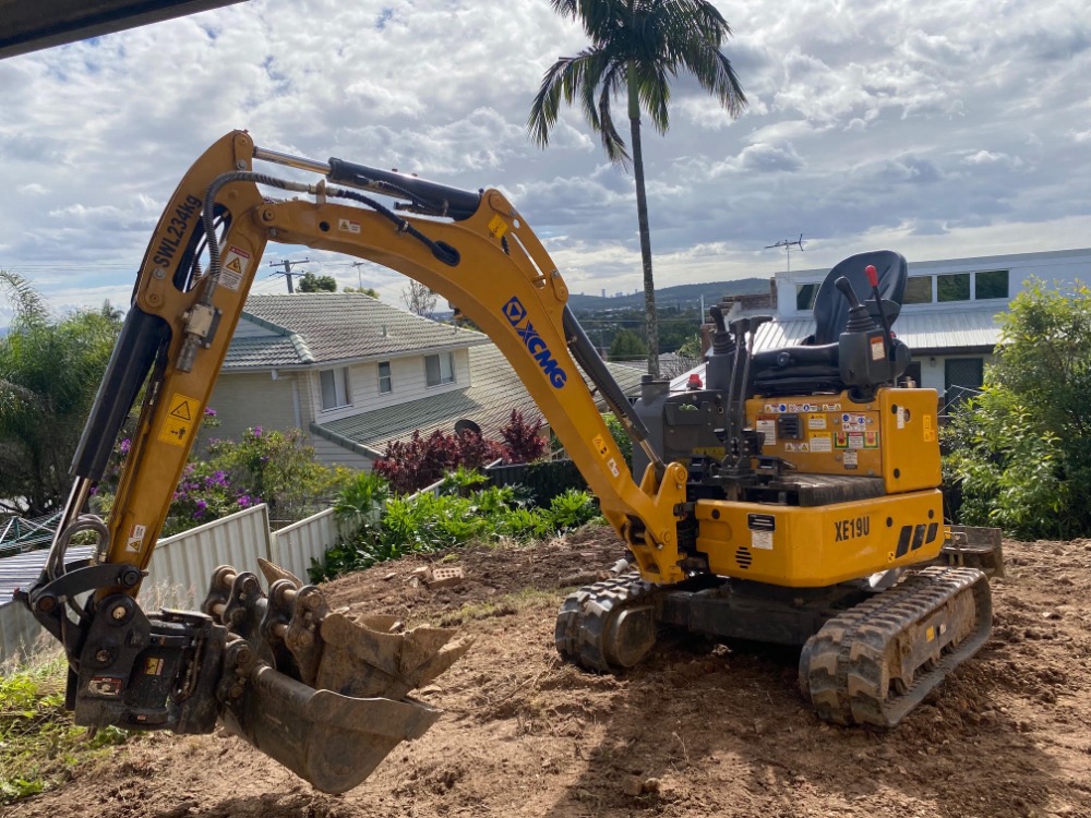 Mini excavator working on a job site